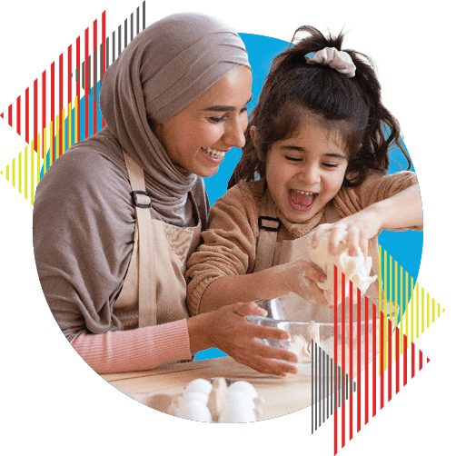 mom and kid in kitchen cooking